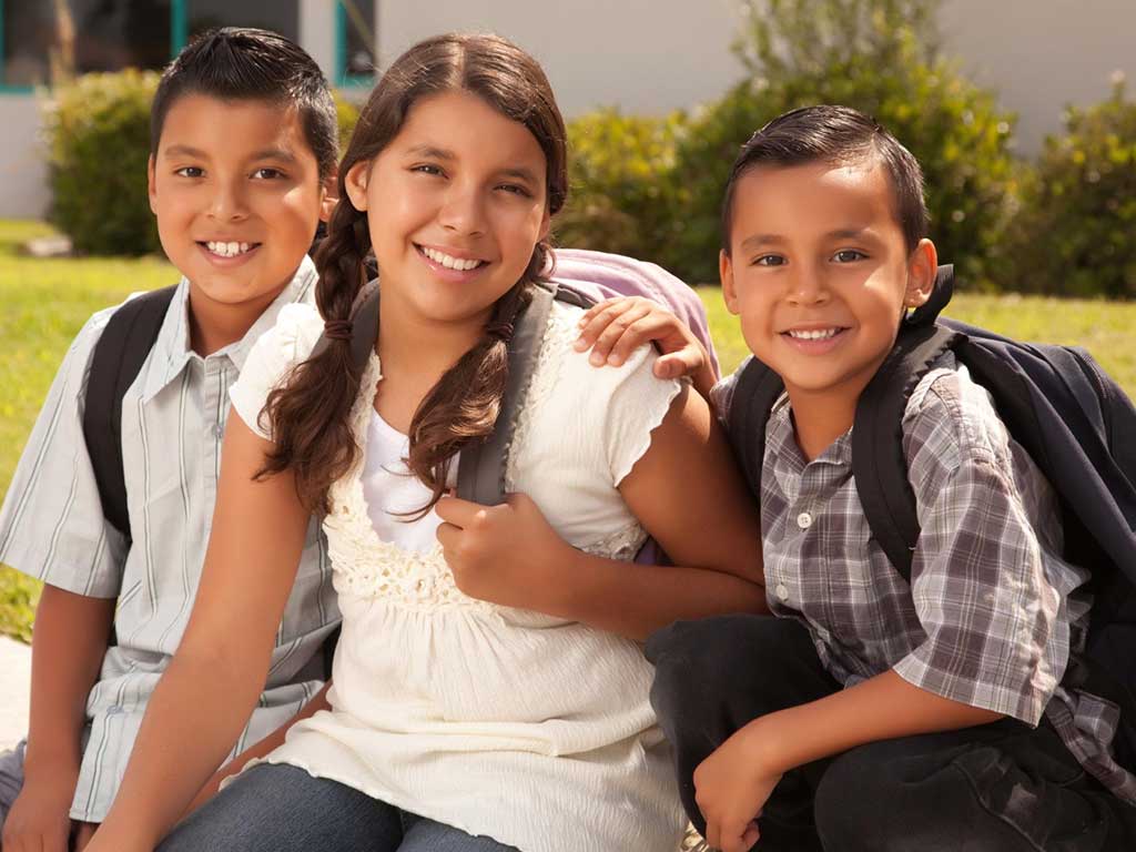 3 kids waiting for school